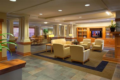 a large living room with furniture and a television