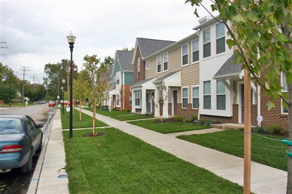 a row of houses on the side of a street