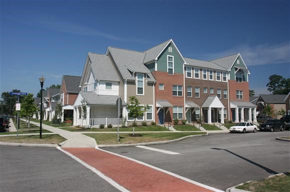 a row of houses on the side of a street