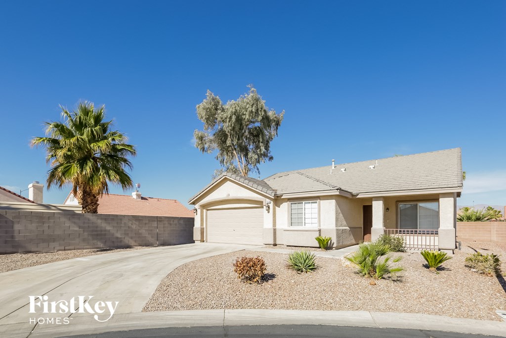 A house with a palm tree in front of it.