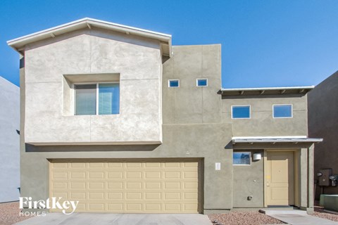 a new house with a garage door in front of it