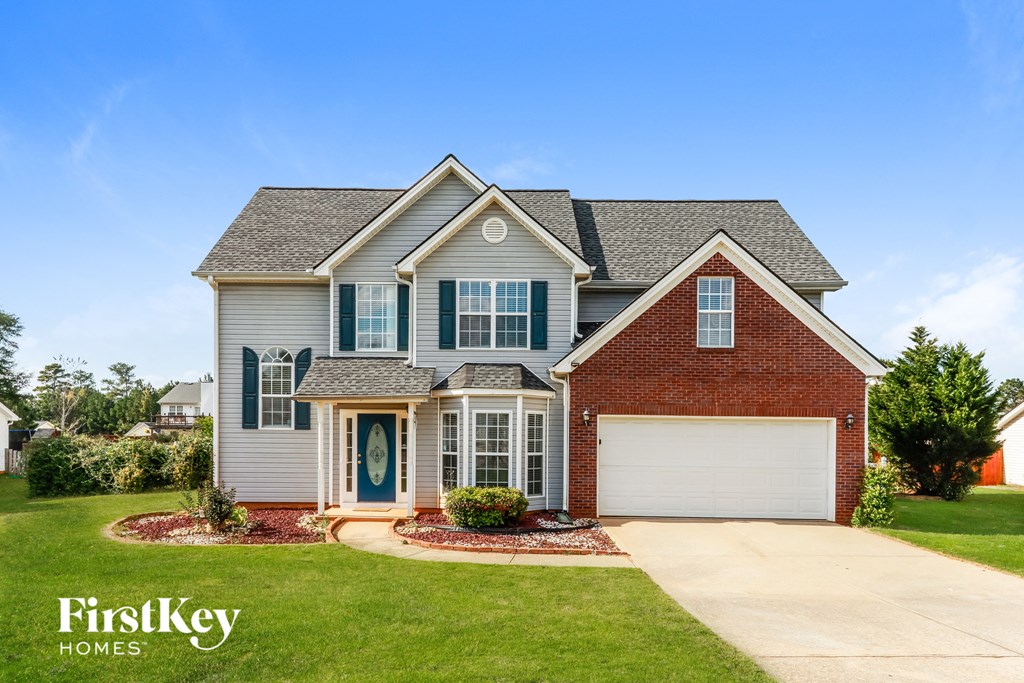 A house with a blue door and a garage.