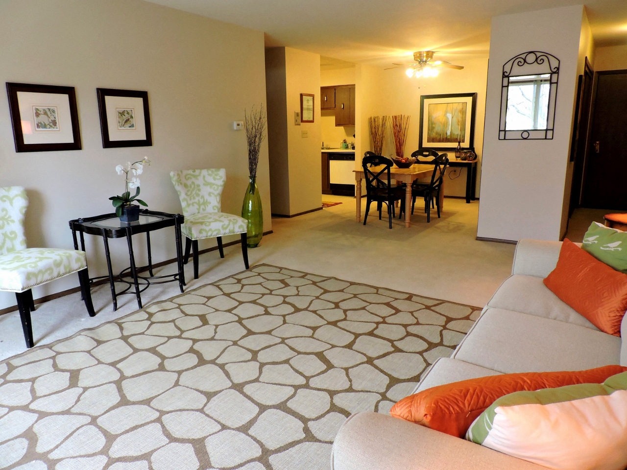 a living room with a couch and a dining room table