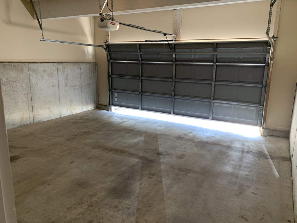 an empty garage with a garage door in it