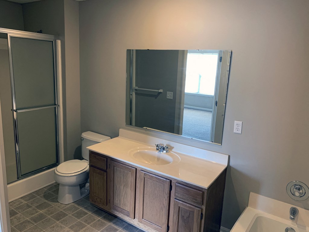 a bathroom with a sink toilet and a shower