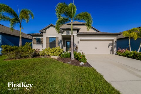 a house with palm trees in front of it
