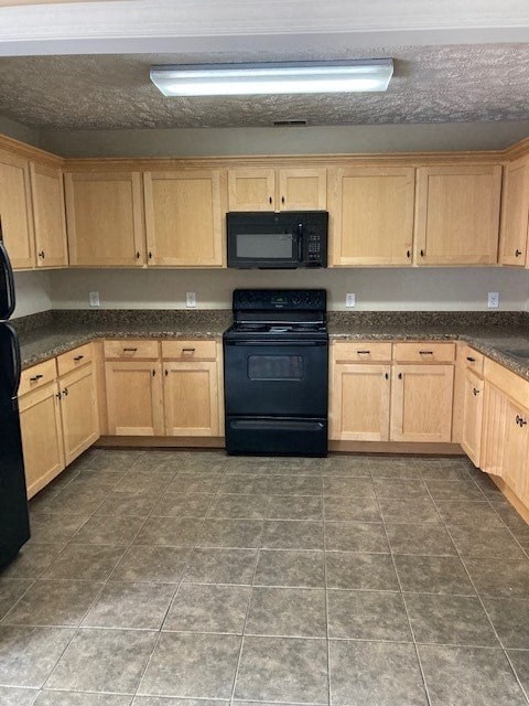 an empty kitchen with a stove and a microwave