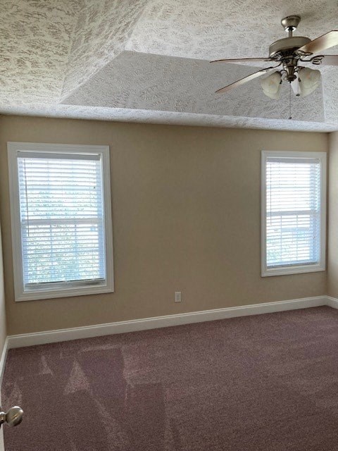 a living room with a ceiling fan and two windows