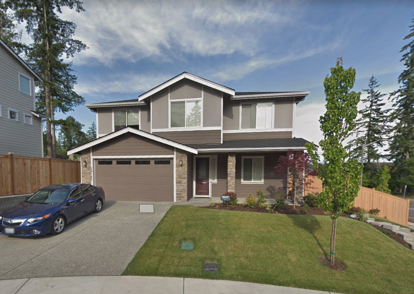 a house with a car parked in front of it