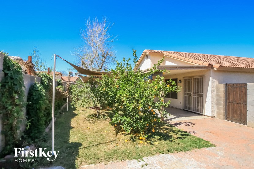 A house with a garden in front of it.