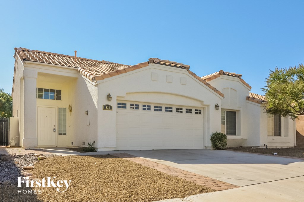 a white house with a white garage door