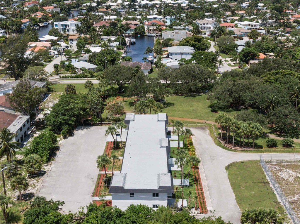 an aerial view of a neighborhood with houses and trees