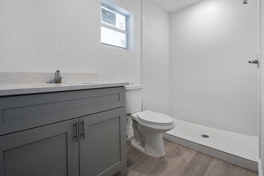 a bathroom with a toilet and a sink