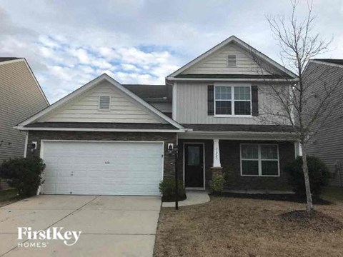 a house with a white garage door in front of it