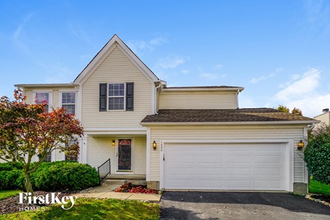 a white house with a white garage door
