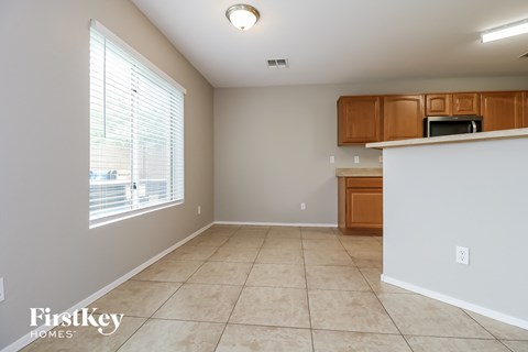 a kitchen and dining room with a large window