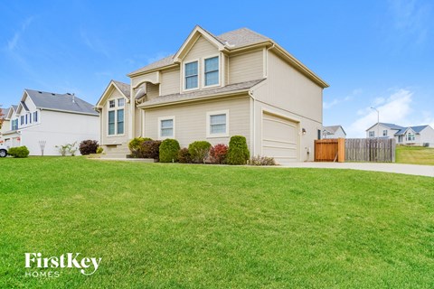A large house with a garage is for sale by FirstKey Homes.