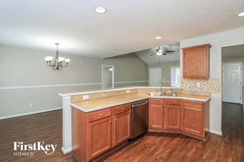 a kitchen with wooden cabinets and a counter top