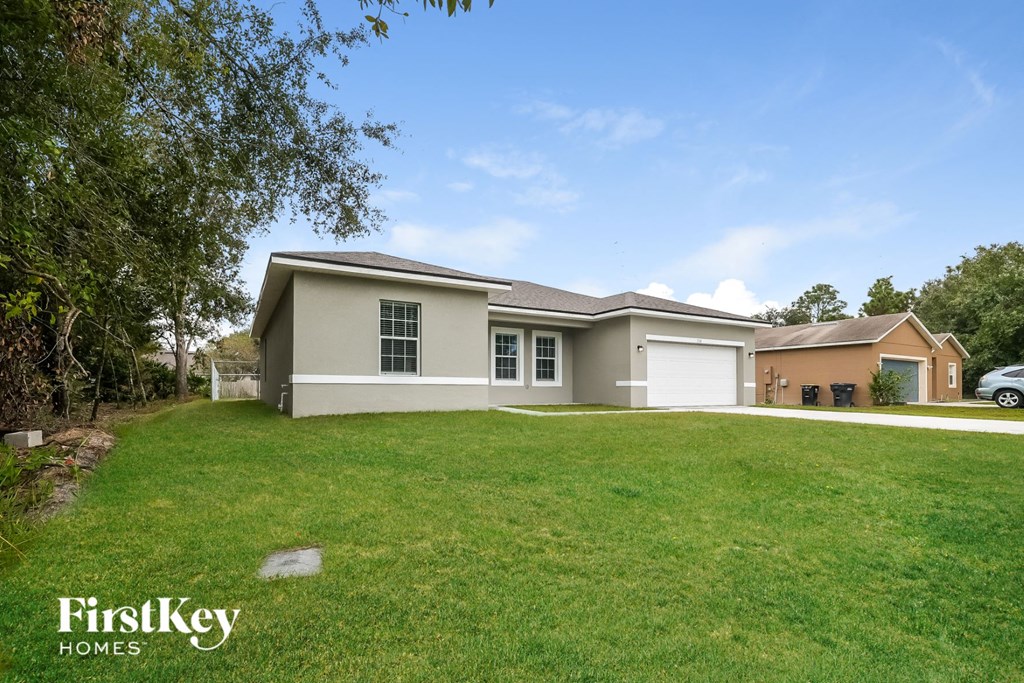 A house with a garage is for sale by FirstKey Homes.