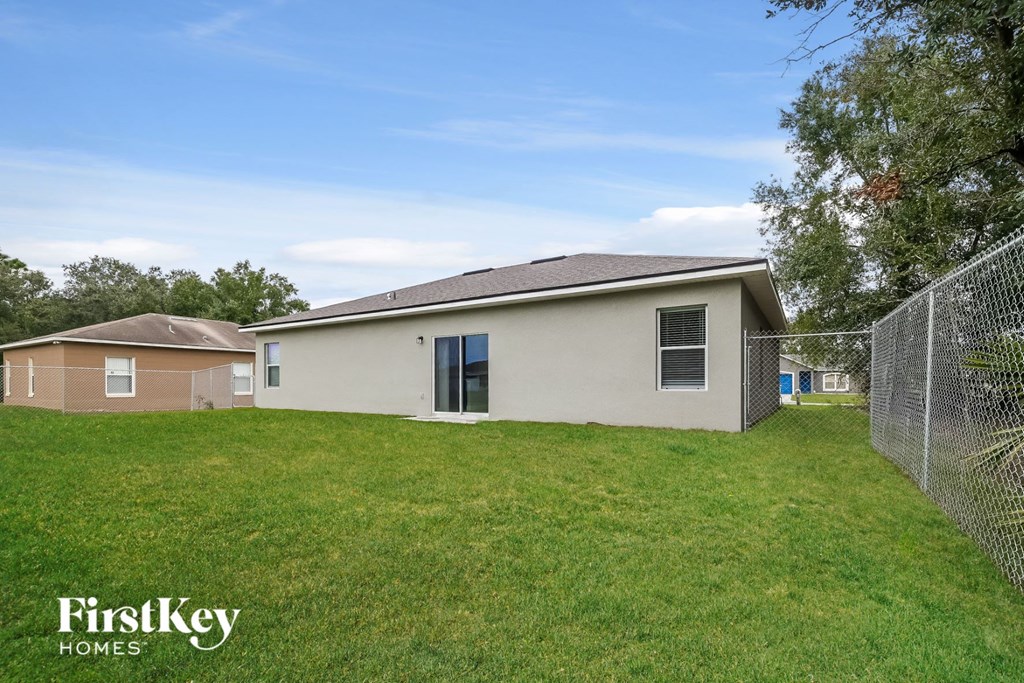A house with a fence in front of it.