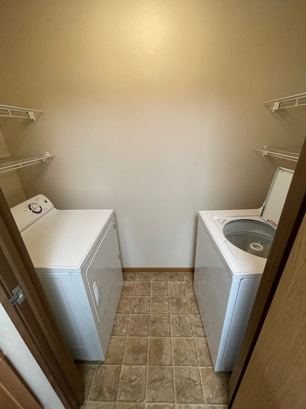 a laundry room with a washer and a dryer