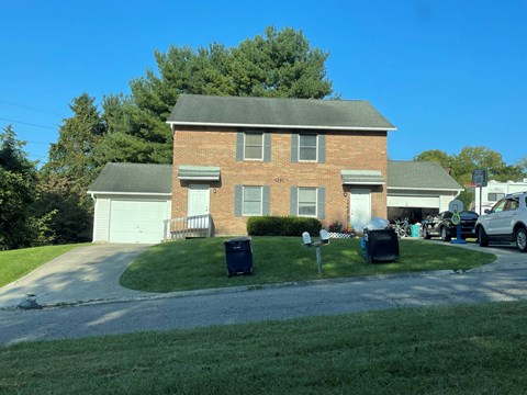 A house with a garage and a driveway.