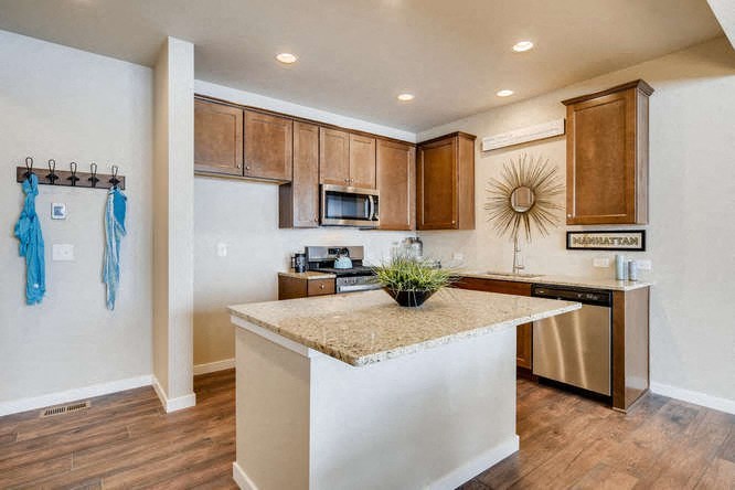a kitchen with a counter top and a refrigerator