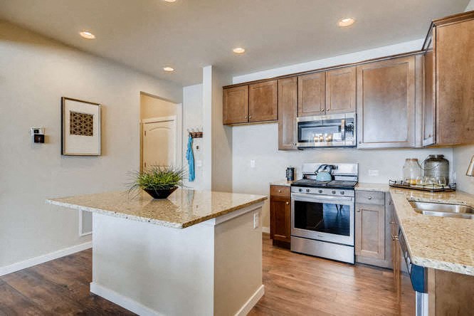 a kitchen with a counter top and a stove