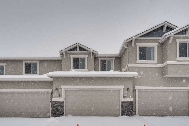 a house is covered in snow