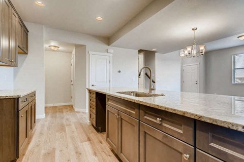 a kitchen with a sink and a counter top