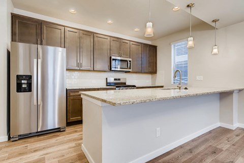 a kitchen with stainless steel appliances and a counter top