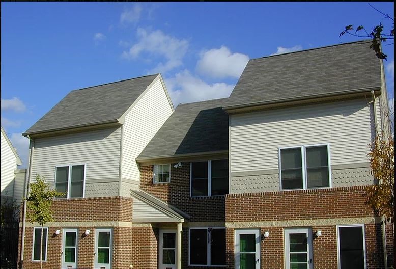 a brick and with a gray roof