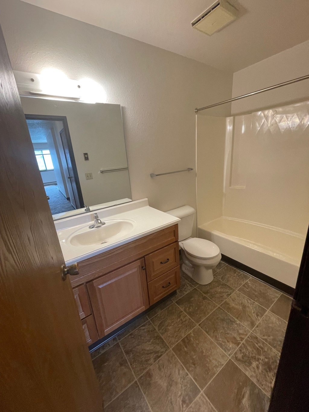 a bathroom with a sink toilet and a shower