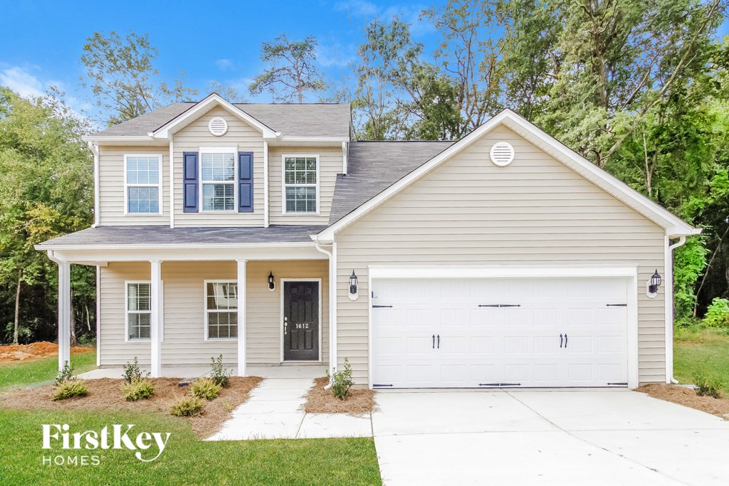 a renovated house with a white garage door
