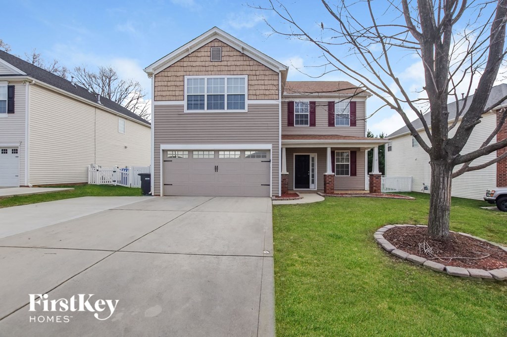a large house with a driveway in front of it