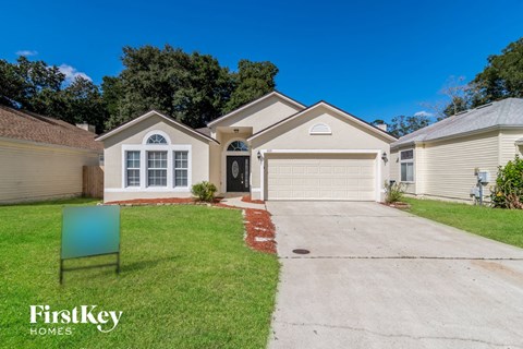 a home with a driveway and a garage door