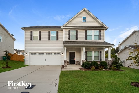 a white house with a white garage door