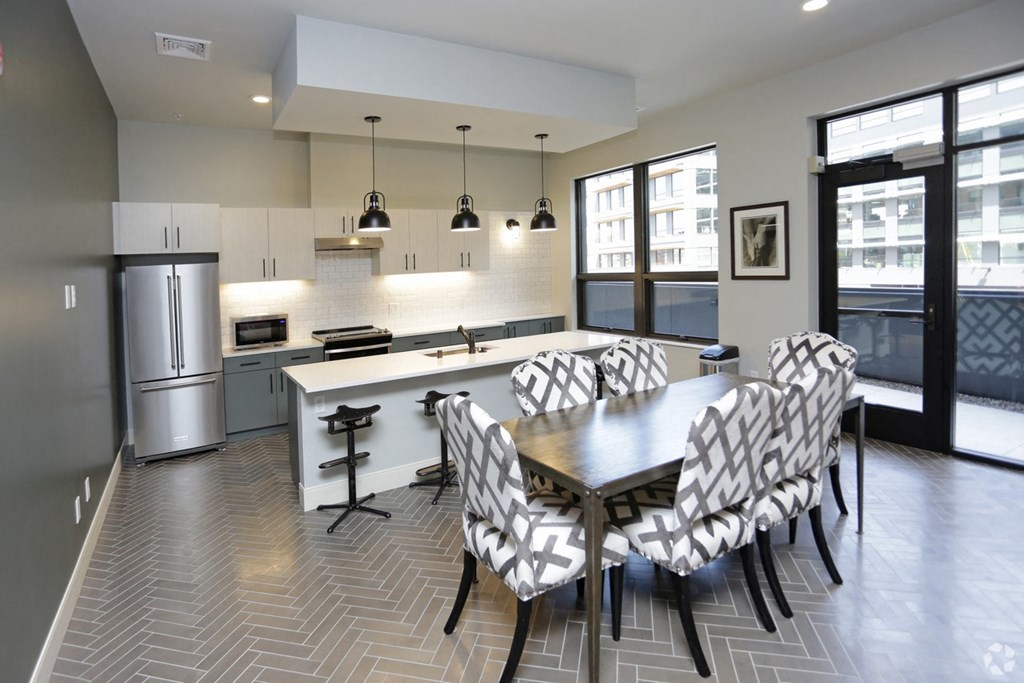 a kitchen and dining room with a table and chairs