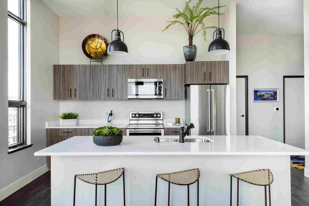 a kitchen with a white counter top