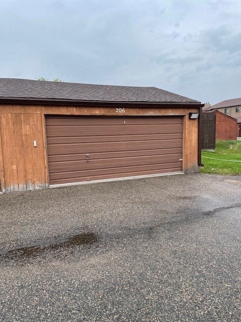 a brown garage door on the side of a building