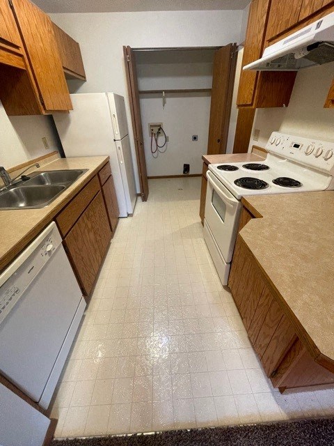 a kitchen with a stove and a sink