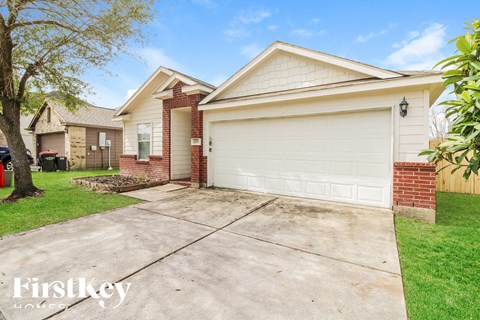 A house with a white garage door is for sale.