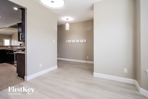 a renovated living room and kitchen in a new home