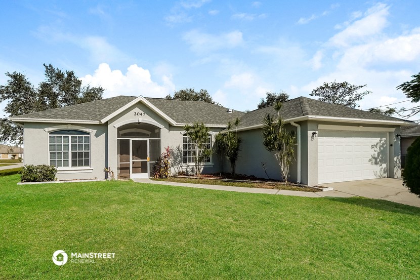 a house with a lawn in front of it