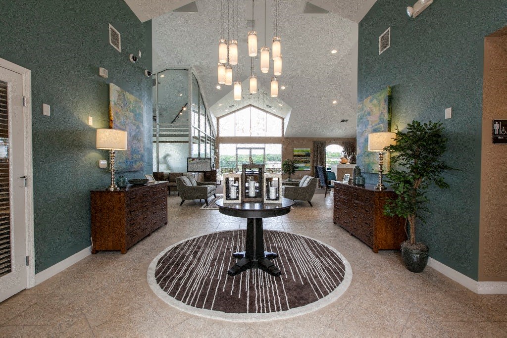a large lobby with a round table in the middle