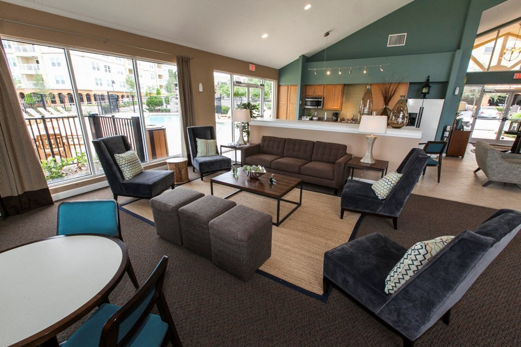 a living room with couches and chairs and a table