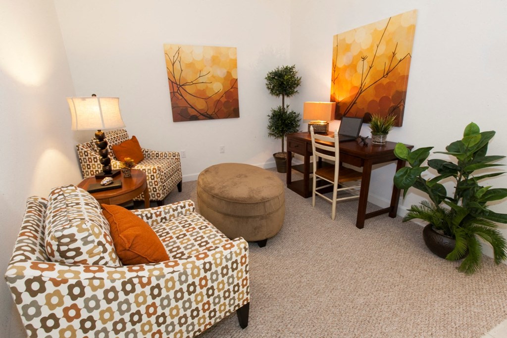 a living room with couches and a dining room table