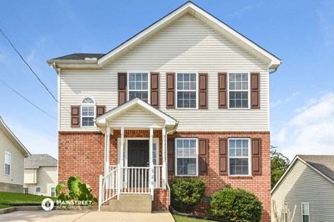 a brick and with a front porch and