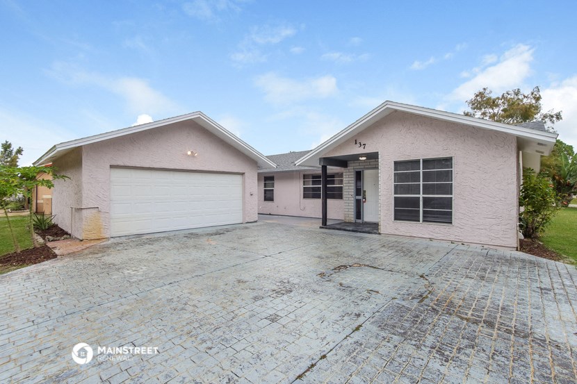 a house with a driveway and a garage door