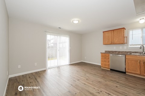 the living room and kitchen of an apartment